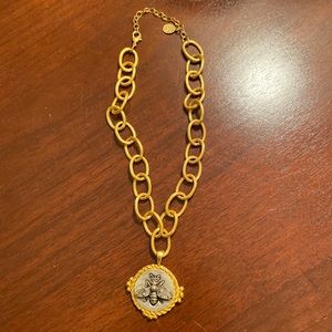 Susan Shaw necklace with gold chain and gold and silver pendant with bee